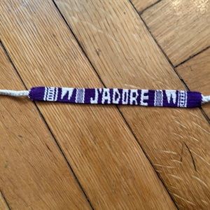 Jadore- Christian Dior purple ribbon bracelet.